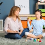 child behaviour specialist sitting with a child